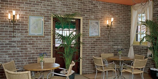 Interior of a restaurant or home featuring a brick slip wall