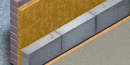 3D diagram of a brick cavity wall filled with grey insulation beads