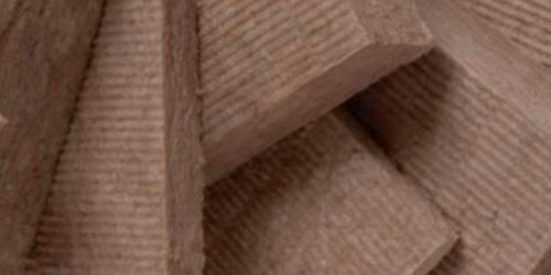Stack of brown dense acoustic insulation boards