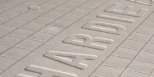 Close-up texture of a cement board embossed with the name "HARDIE"