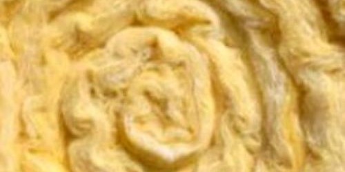 Close-up texture of yellow swirled insulation material
