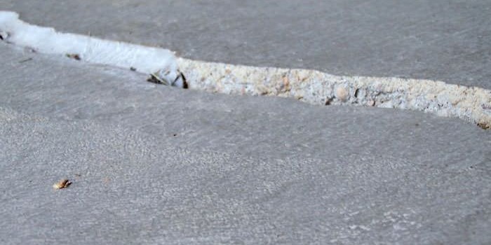 Concrete floor slab with a visible gap or void former