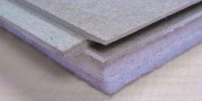 Stack of acoustic floor boards with blue foam backing