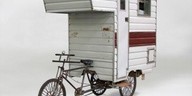 Exterior view of a white camper trailer or mobile home
