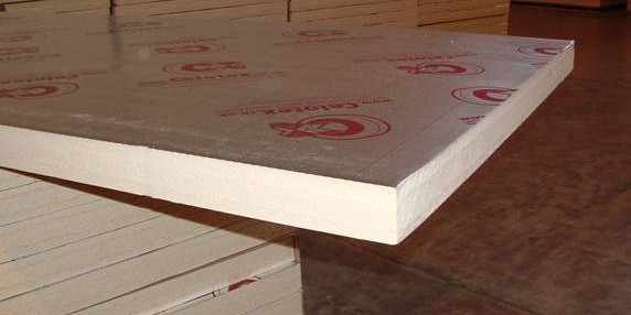 Rigid insulation boards stacked on a construction site