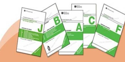 Pile of green and white brochures or planning documents