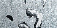 Close-up of water droplets condensing on a surface