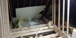 Attic space under renovation with exposed wooden beams